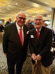 Attorneys Robert Skemp and Tom Sleik stand side-by-side smiling.