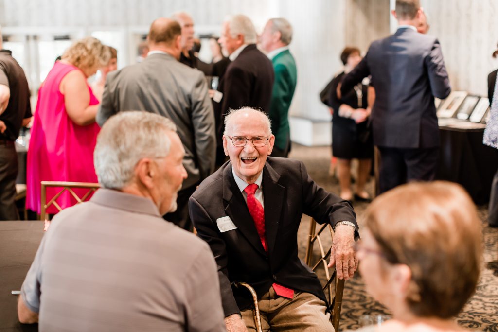 Robert C. Skemp smiles as he talks to guests at the 100th anniversary celebration.