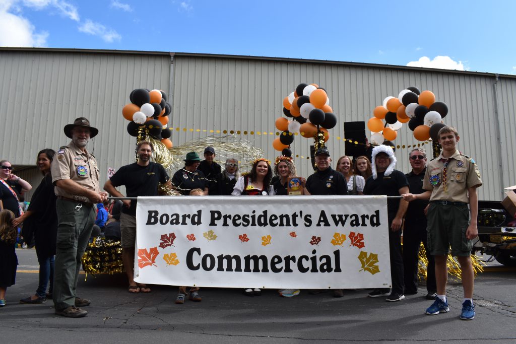 The Hale Skemp team poses with their float after winning the Board President's Award in the Maple Leaf Parade 2019.